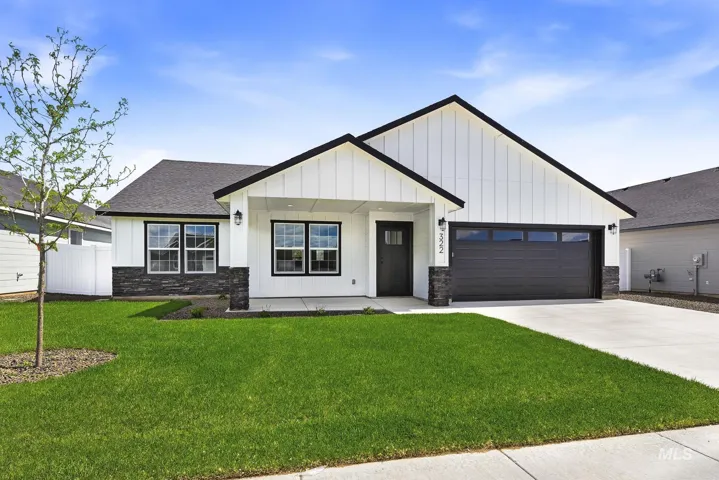 Contemporary single-story residence featuring white board-and-batten siding