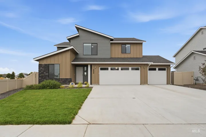 Contemporary exterior with mixed material siding and stone accents