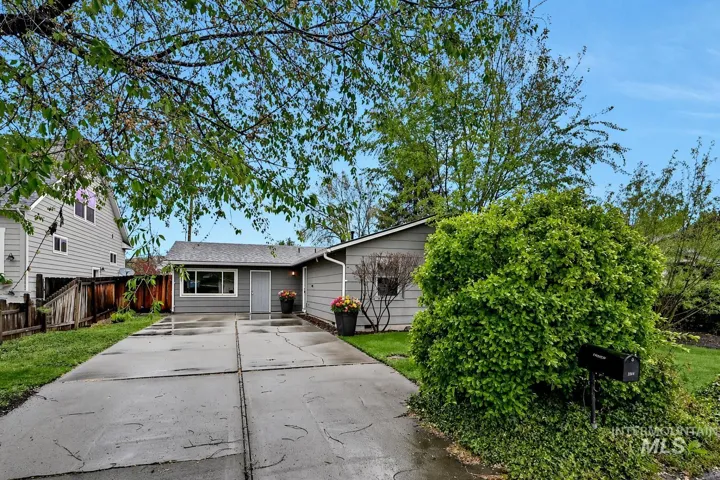 Extended driveway leading to front yard and front of house with door to main house and separate entrance to the studio. Plenty of off-street parking and as well as room for an RV or trailer.