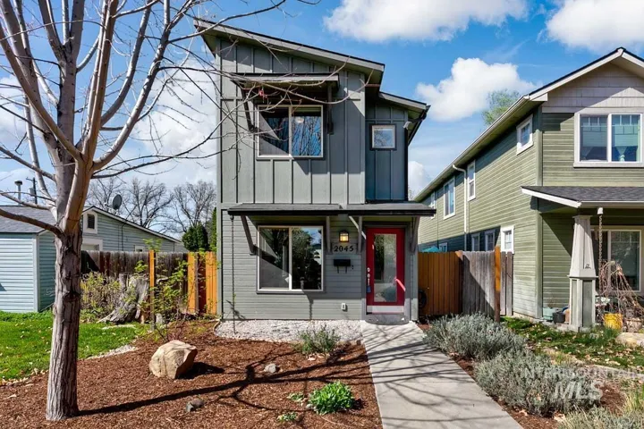 View of front of house with board and batten siding
