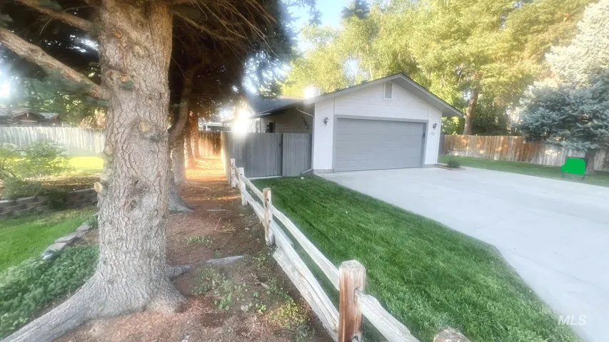 View of front of property featuring driveway and a garage