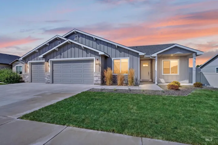 Contemporary exterior with board and batten siding, stone accents, and a covered entry