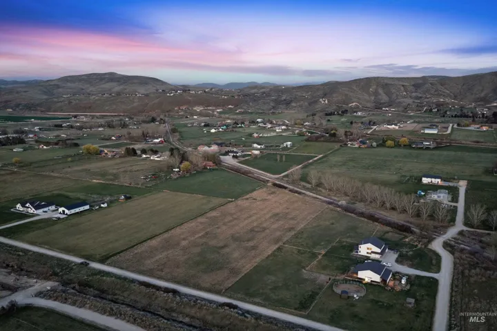 Aerial view at dusk of a mountain view and a view of countryside