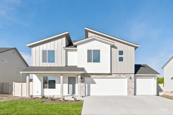 Contemporary exterior featuring white siding, light grey vertical siding, and a stone accent facade