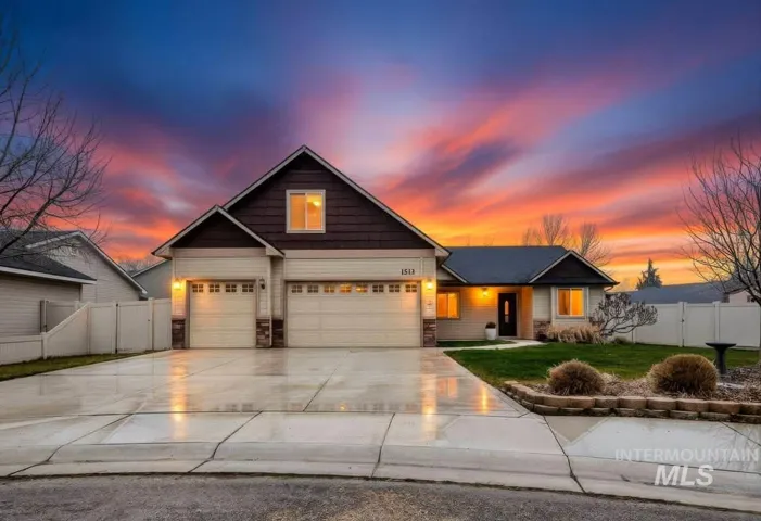 Craftsman inspired home featuring driveway, a garage, and stone siding