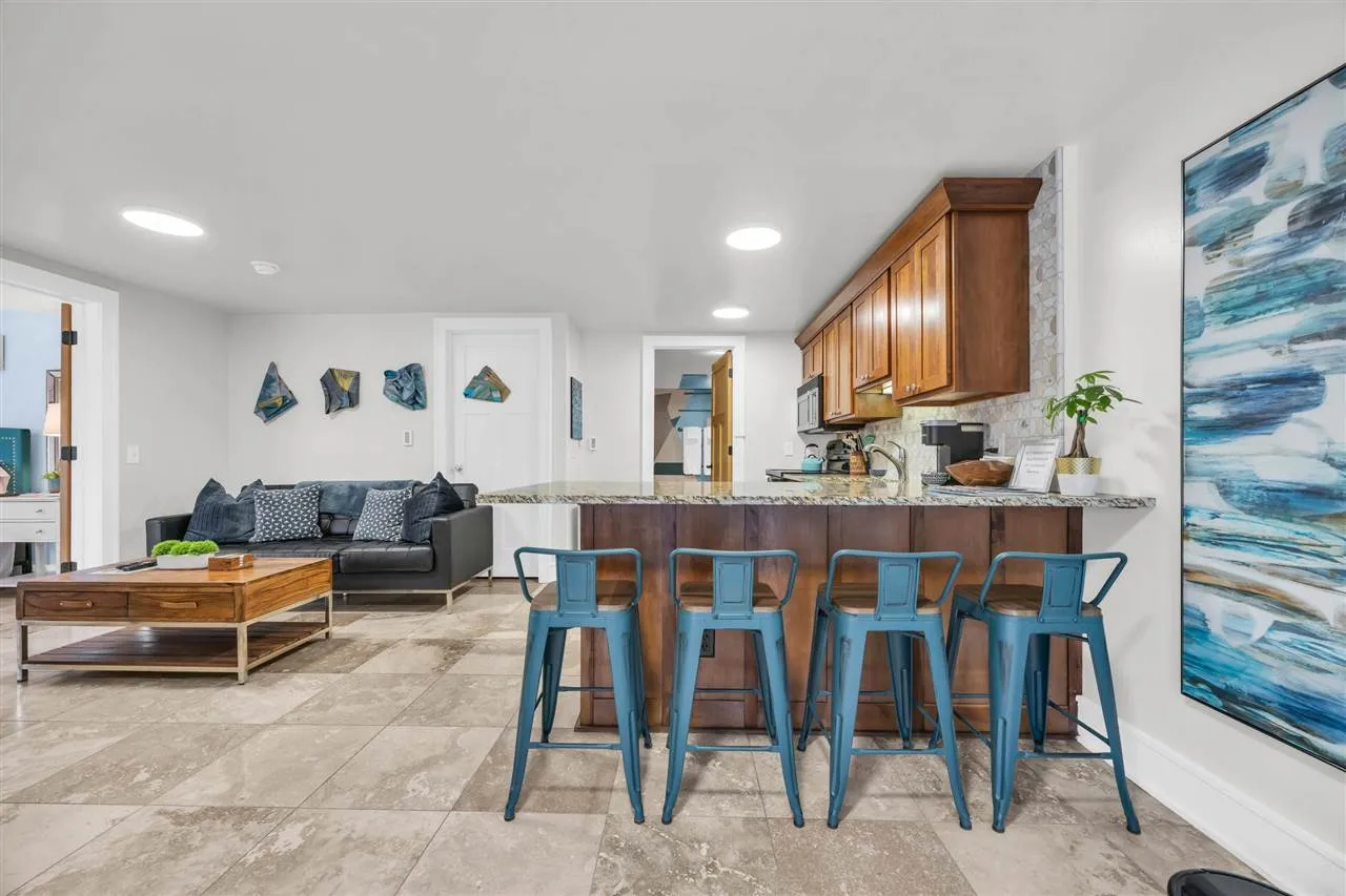 This separate lower level living unit is complete with bedroom, kitchen, bath and fantastic views.