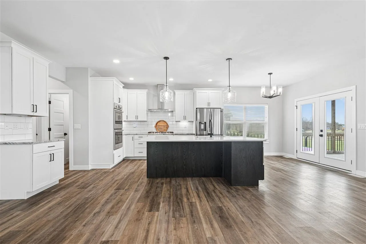 Upgraded Maple Cabinets, Walk-in Pantry, Double Ovens, Gas Range, Hood Vent