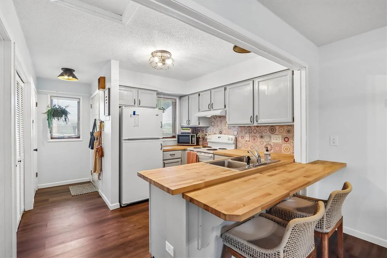 Butcher block countered in the kitchen and breakfast bar