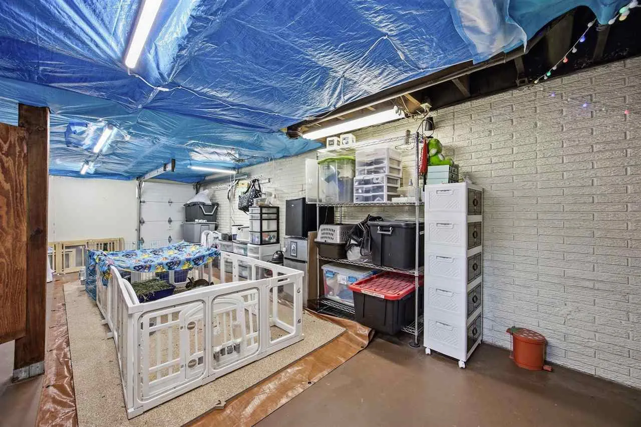 Lower level storage room with utility garage door